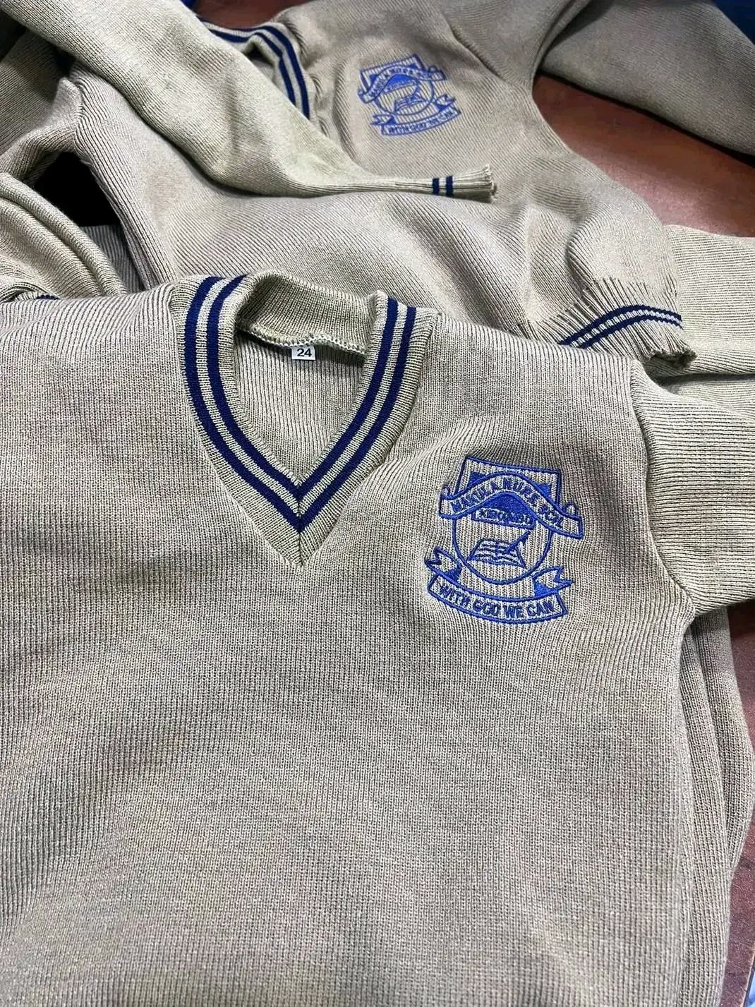 School sweaters with embroidered badge